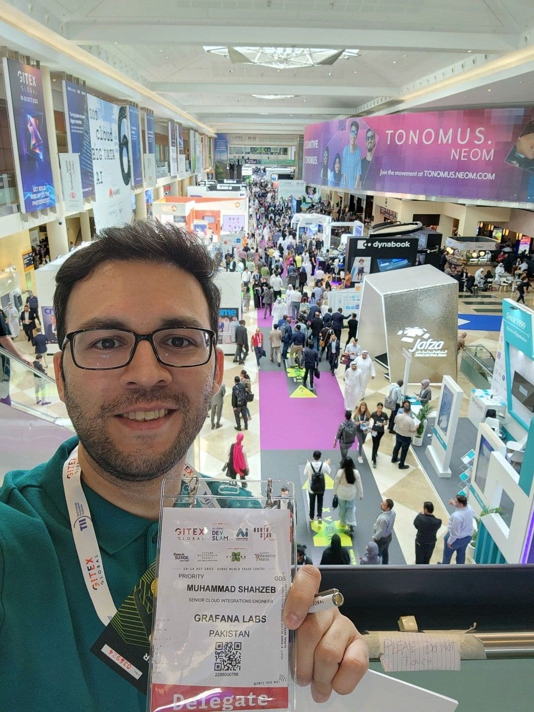 Muhammad Shahzeb at GITEX Global in Dubai, wearing a Grafana Labs delegate badge